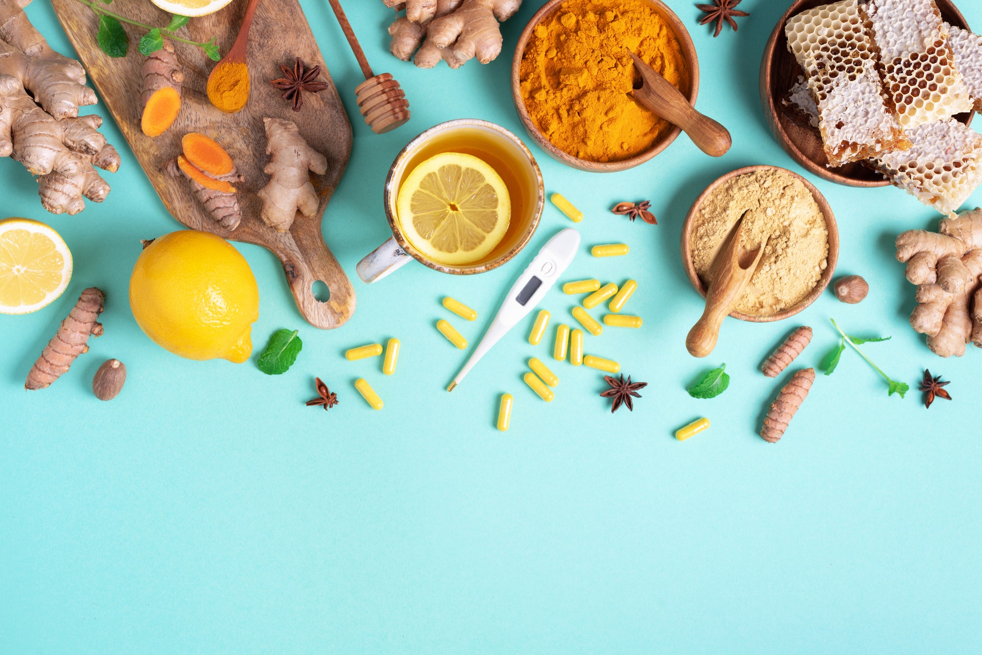 Healthcare, flu and cold treatment. Naturopathy concept. Ginger, lemon, honey, pills, drugs